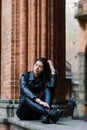 Portrait of beautiful young blonde woman wearing stylish black outfit, she smiling on urban background, happy time, Travel Concept Royalty Free Stock Photo