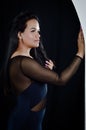 Portrait of a beautiful young Brazilian woman with one hand resting on the wall Royalty Free Stock Photo