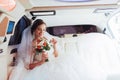 Portrait of a beautiful young bride in the car Royalty Free Stock Photo