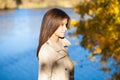 Portrait of a beautiful brunette little girl, autumn park outdoors Royalty Free Stock Photo