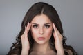 Woman touching her temples Royalty Free Stock Photo