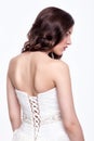 Portrait of beautiful young brunette woman bride in white Wedding Dress from back side Royalty Free Stock Photo