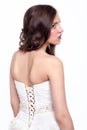 Portrait of beautiful young brunette woman bride in white Wedding Dress from back side Royalty Free Stock Photo