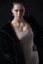 Portrait of woman with Jewellery in luxury long black fur coat Royalty Free Stock Photo