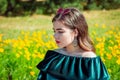 Portrait of beautiful young brunette woman in a garden Royalty Free Stock Photo