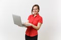 Portrait of beautiful young business teacher woman user in red shirt, glasses working typing on laptop pc computer
