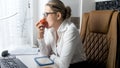 Portrait of beautiful young businesswoman having lunch on working place Royalty Free Stock Photo