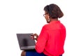 Portrait of a beautiful young businesswoman showing a credit card near the laptop . Royalty Free Stock Photo