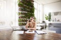 Attractive businesswoman making a call while sitting in front of laptop in the office and working Royalty Free Stock Photo