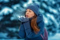 Portrait of a beautiful young cheerful woman in winter in nature Royalty Free Stock Photo