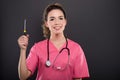 Portrait of beautiful young doctor holding screwdriver