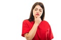 Portrait of beautiful young doctor wearing scrubs making thinking gesture Royalty Free Stock Photo