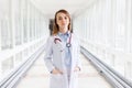 Portrait of beautiful young female doctor with stethoscope in clinic Royalty Free Stock Photo