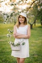 Portrait of a beautiful young girl in a blooming apple orchard in spring Royalty Free Stock Photo