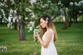 Portrait of a beautiful young girl in a blooming apple orchard in spring Royalty Free Stock Photo