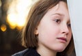 Portrait of a beautiful young girl looking into the distance