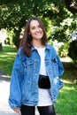 Portrait of beautiful young girl posing in summer park. Majestic woman`s beauty. Youth, happiness