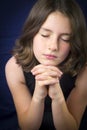 Portrait of beautiful young girl praying Royalty Free Stock Photo