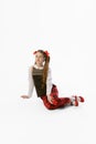 Portrait of beautiful young girl, teen in retro style clothes posing at white studio background. Concept of art, beuty