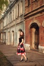 Portraportrait of a beautiful young girl in an urban environmentit of a beautiful smiling girl in lilac Royalty Free Stock Photo