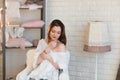 Portrait of a beautiful young girl in a white knit sweater, winter, comfort, warmth, lifestyle, hair, makeup Royalty Free Stock Photo