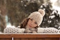 Portrait of beautiful, cute girl in winter hat, winter forest Royalty Free Stock Photo