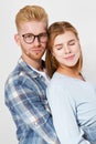 Portrait of a beautiful young happy smiling elegant couple - isolated mock up, background people.B eautiful young happy couple Royalty Free Stock Photo