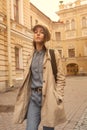 Portrait of a beautiful young hipster girl walks through the streets the old town fun and smiling Royalty Free Stock Photo