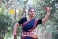 Portrait of beautiful young Indian classical odissi dancer wears traditional costume and posing Odissi dance mudra in the