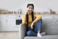 Portrait Of Beautiful Young Indian Woman Talking On Mobile Phone At Home Royalty Free Stock Photo