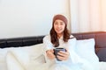 Portrait of a beautiful young lady drinking her morning coffee in her bedroom Royalty Free Stock Photo