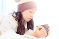 Portrait of a beautiful young lady drinking her morning coffee in her bedroom Royalty Free Stock Photo