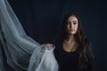 Portrait of a Beautiful young long haired woman with her arm wrapped in white fabric looking proud Royalty Free Stock Photo