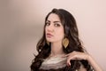 Portrait Of Beautiful Young Mediterranean And Middle Eastern Brunette Hair Girl With Leaf Shape Gold Earrings, Glossy Lips Make U