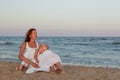 Portrait of a beautiful young mother and daughter on the seashore Royalty Free Stock Photo