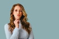 portrait of beautiful young pensive thoughtful woman with long curly hair contemplation Royalty Free Stock Photo