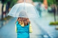 Portrait of beautiful young pre-teen girl with umbrella under rain Royalty Free Stock Photo