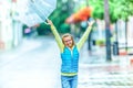 Portrait of beautiful young pre-teen girl with umbrella under rain Royalty Free Stock Photo