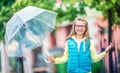 Portrait of beautiful young pre-teen girl with umbrella under rain Royalty Free Stock Photo