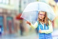 Portrait of beautiful young pre-teen girl with umbrella under rain Royalty Free Stock Photo