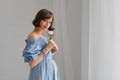 Portrait of a beautiful young pregnant woman in a blue dress Royalty Free Stock Photo