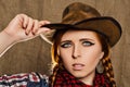 Portrait of a beautiful young red-haired girl in a cowboy hat Royalty Free Stock Photo