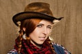 Portrait of a beautiful young red-haired girl in a cowboy hat Royalty Free Stock Photo
