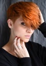 Portrait of a beautiful young red-haired woman with short hair Royalty Free Stock Photo