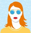 Beautiful redhead woman with golden sunglasses