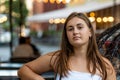 Portrait of beautiful young swoman outdoor over blurred street background Royalty Free Stock Photo