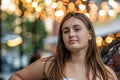 portrait of beautiful young swoman outdoor over blurred street background Royalty Free Stock Photo