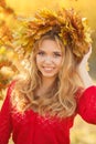 Portrait of beautiful young woman in autumn park. Royalty Free Stock Photo