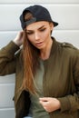 Portrait of a beautiful young woman in a black baseball cap Royalty Free Stock Photo