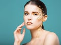 Portrait of a beautiful young woman with bright golden make up Royalty Free Stock Photo